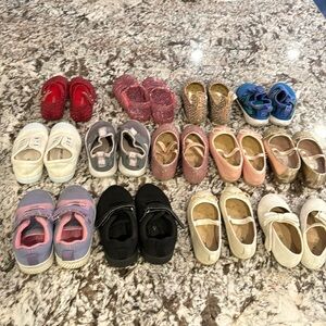 14 pairs of size 7 toddler girls shoes.